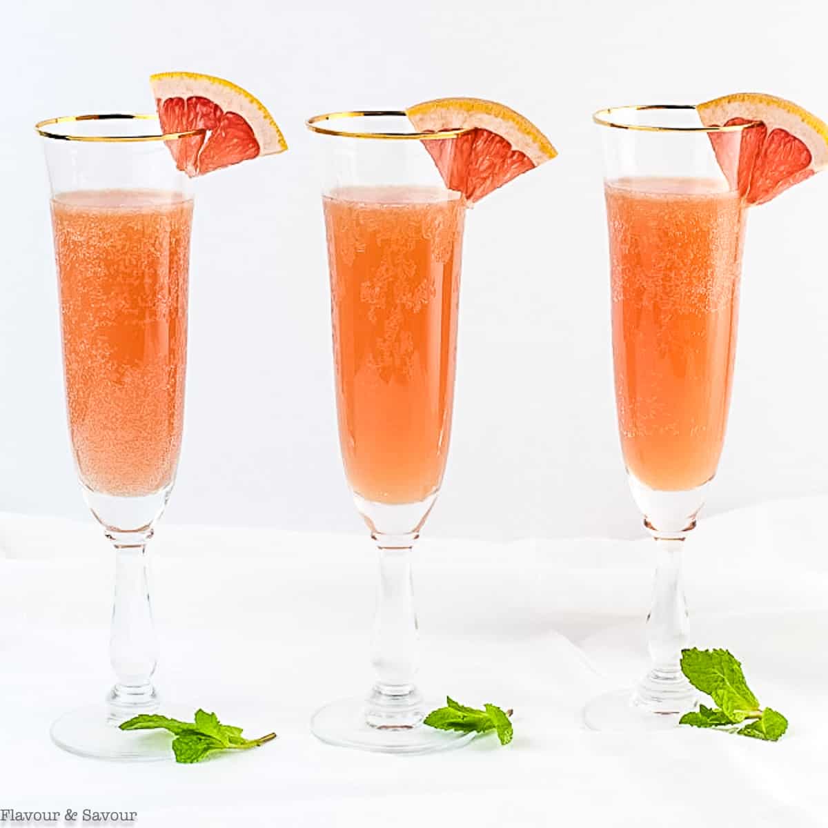 champagne glasses with grapefruit spritzer mocktail