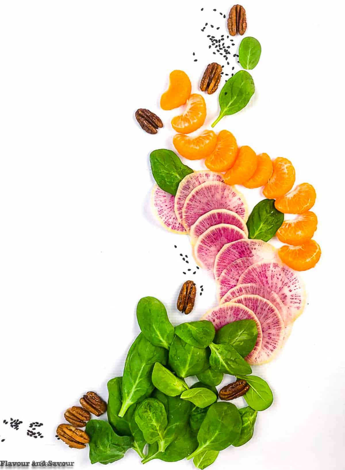 Ingredients for Watermelon Radish Salad with spinach and oranges.