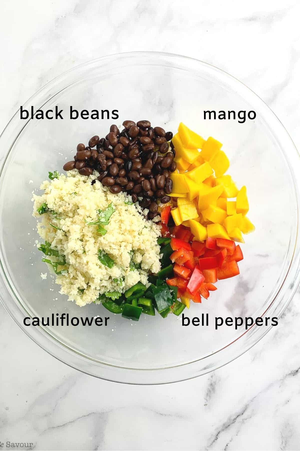 a bowl with ingredients to make Caribbean-style couscous salad with cauliflower couscous