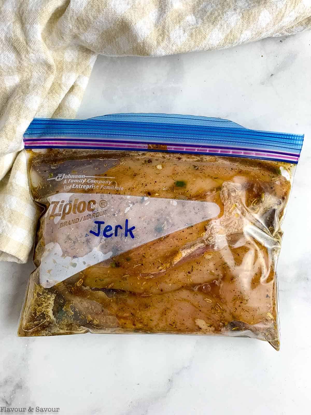 Chicken breasts in a Ziplock freezer bag with jerk marinade.