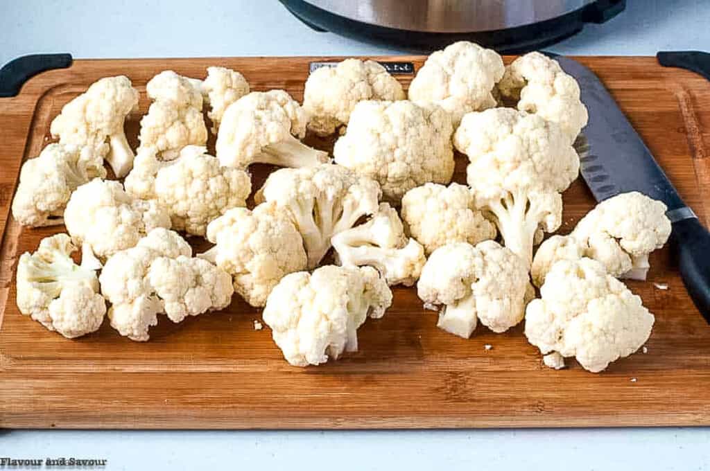 cauliflower florets in a cutting board