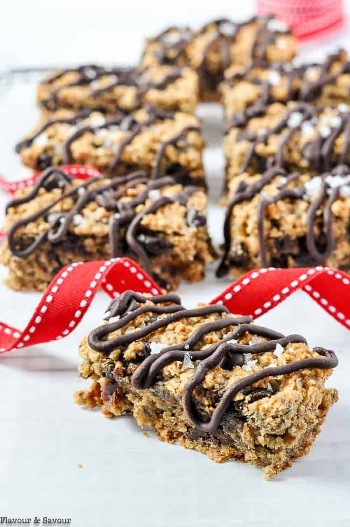 close up view of a chocolate cherry chia oatmeal bar made with oat and sorghum flour