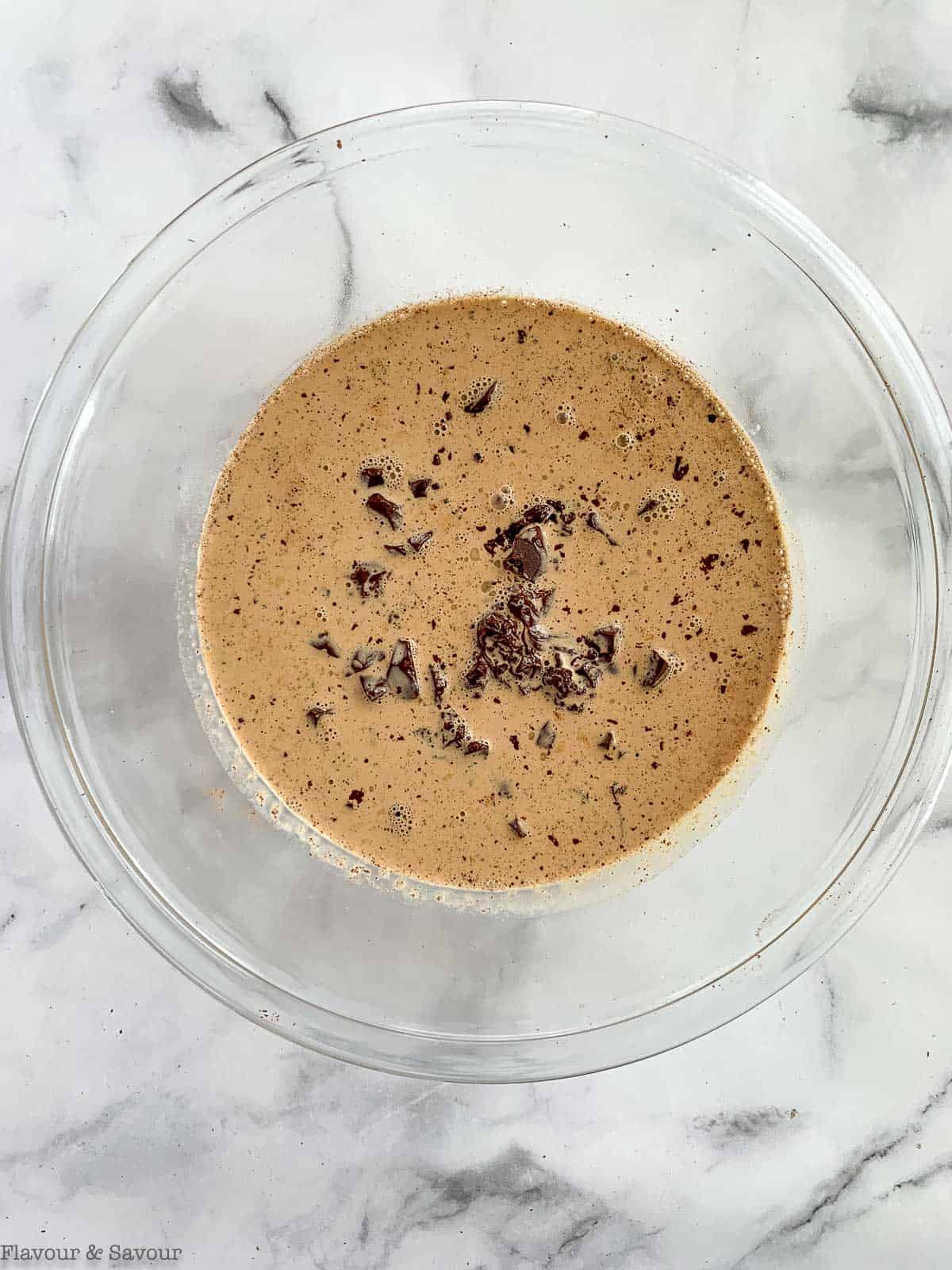 Hot cream poured over chopped chocolate.