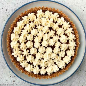 overhead view of espresso chocolate ganache tart with hazelnut crust