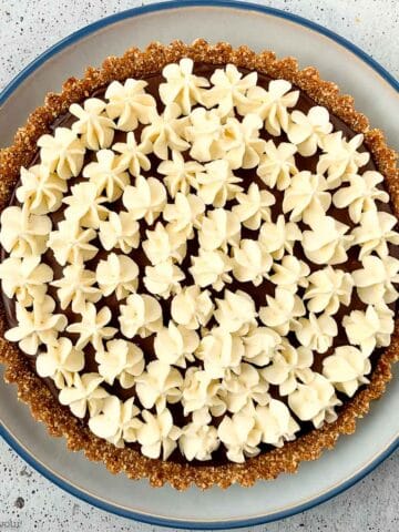 overhead view of espresso chocolate ganache tart with hazelnut crust