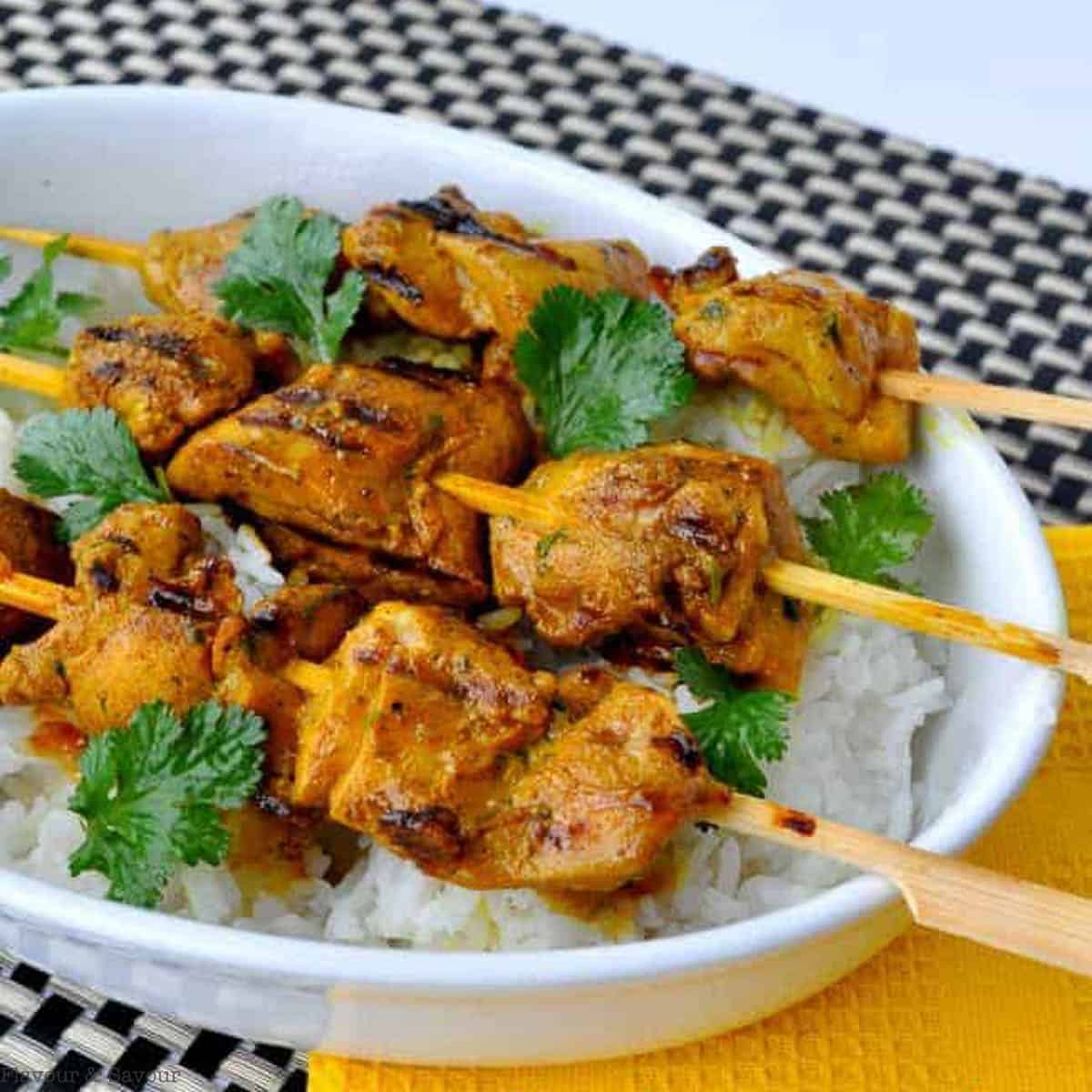 Chicken kabobs on skewers in a Thai-inspired marinade with turmeric.