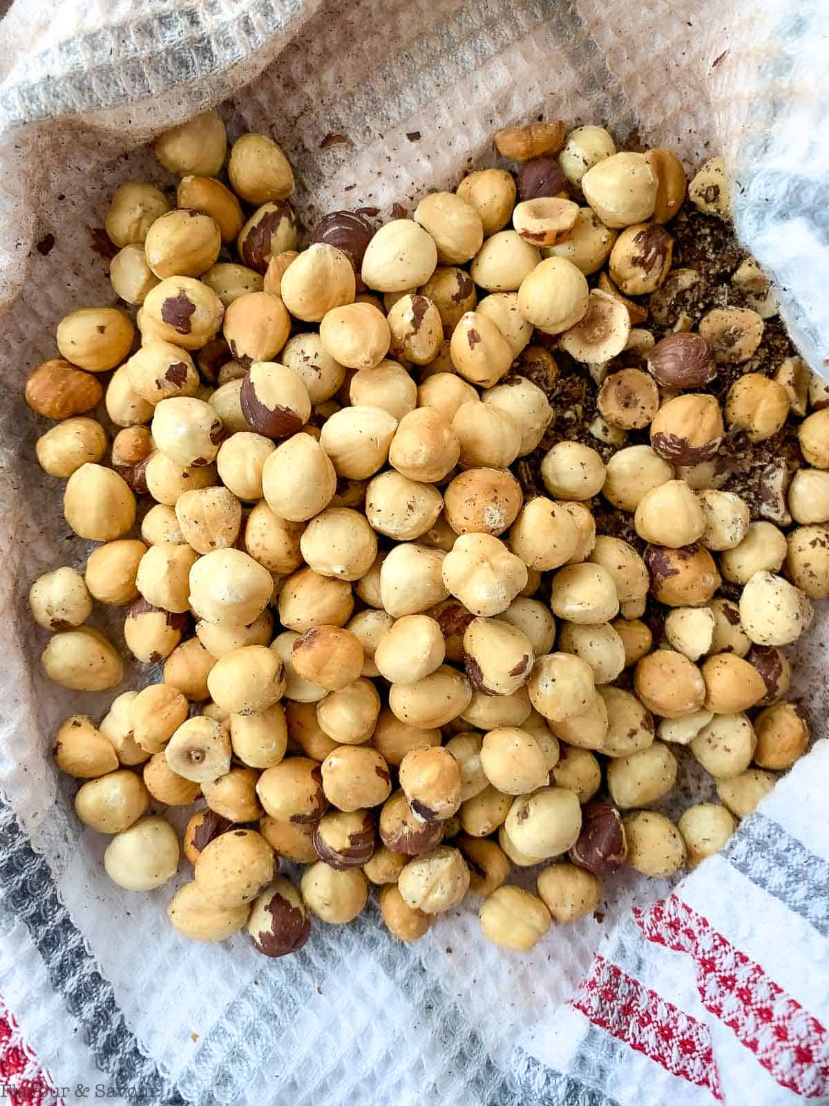 Hazelnuts on  tea towel with skins removed.