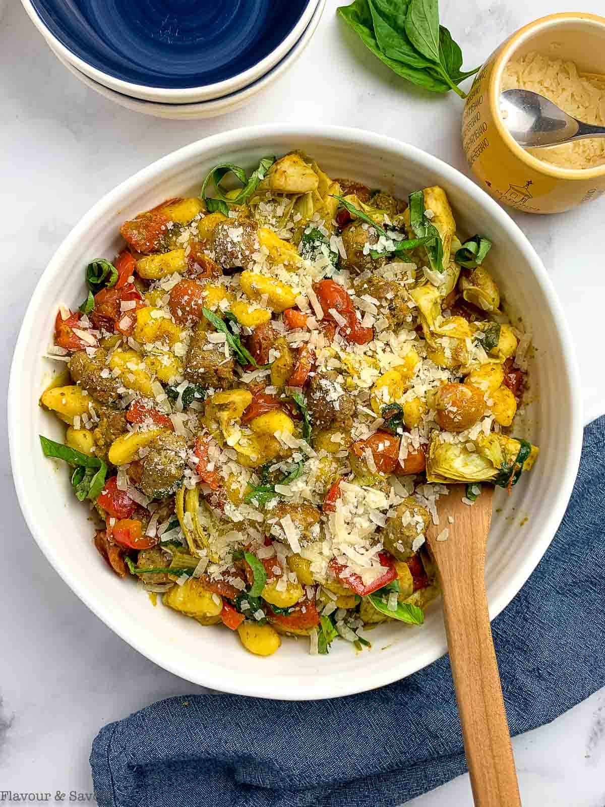 Vegetarian Pesto Gnocchi with grated Parmesan cheese.