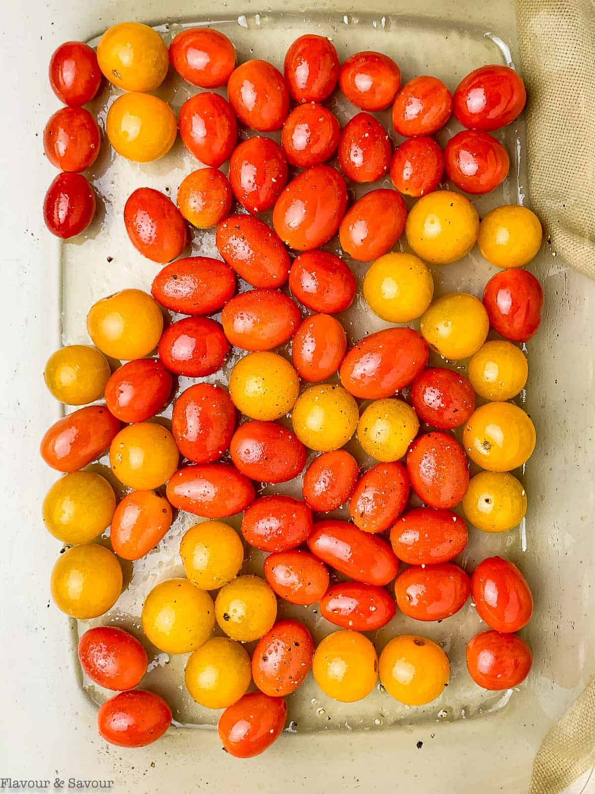 Roasting tomatoes on a baking sheet.