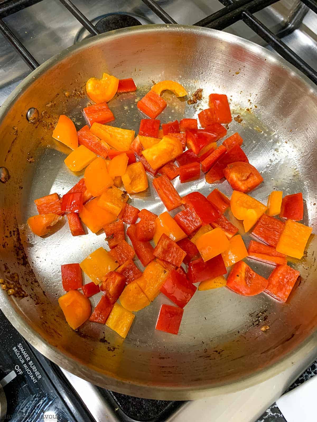 Sauteing red bell peppers.