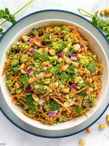 overhead view of a serving bowl with Asian broccoli salad with peanut sauce