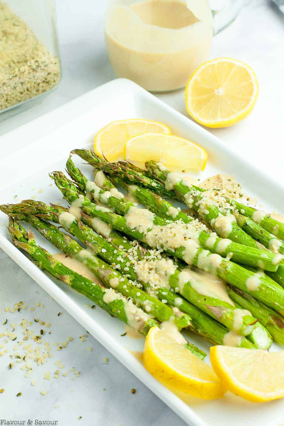 Air fryer asparagus with lemon tahini sauce and hemp hearts