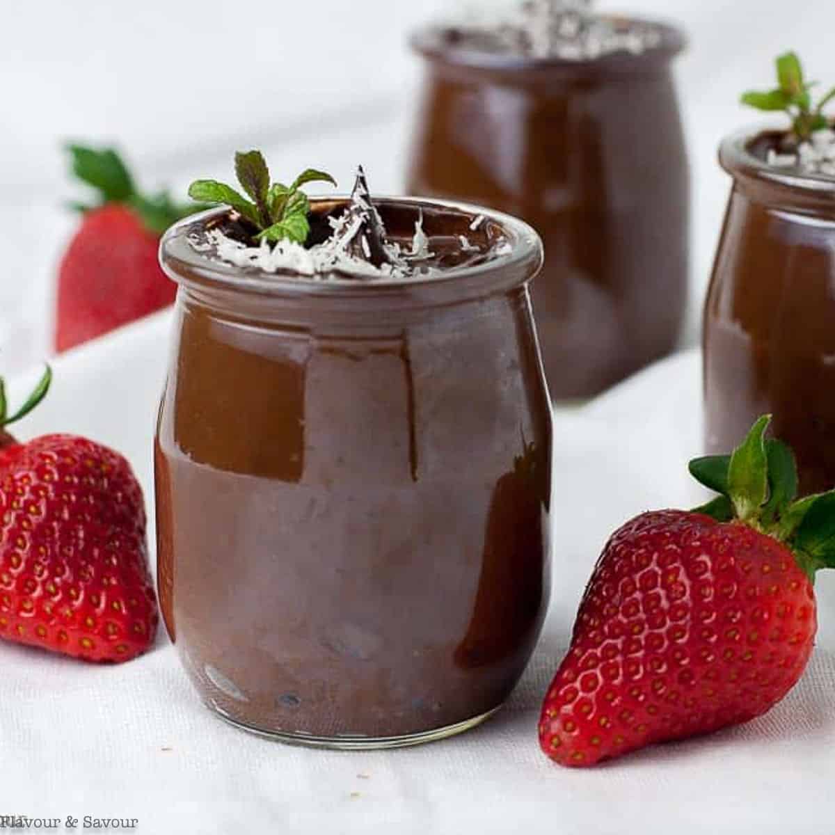 close up view of dairy-free chocolate mousse with fresh strawberries