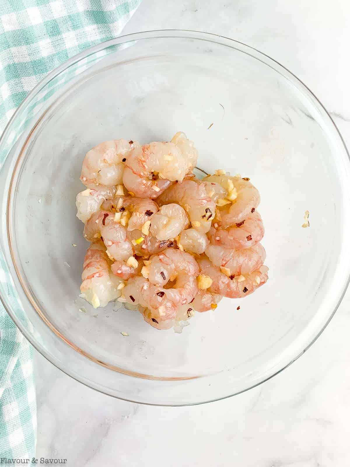 Marinating prawns with Cajun spices.