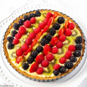Fresh fruit tart with vanilla pastry cream decorated with fresh berries