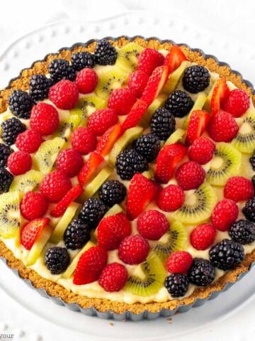Fresh fruit tart with vanilla pastry cream decorated with fresh berries
