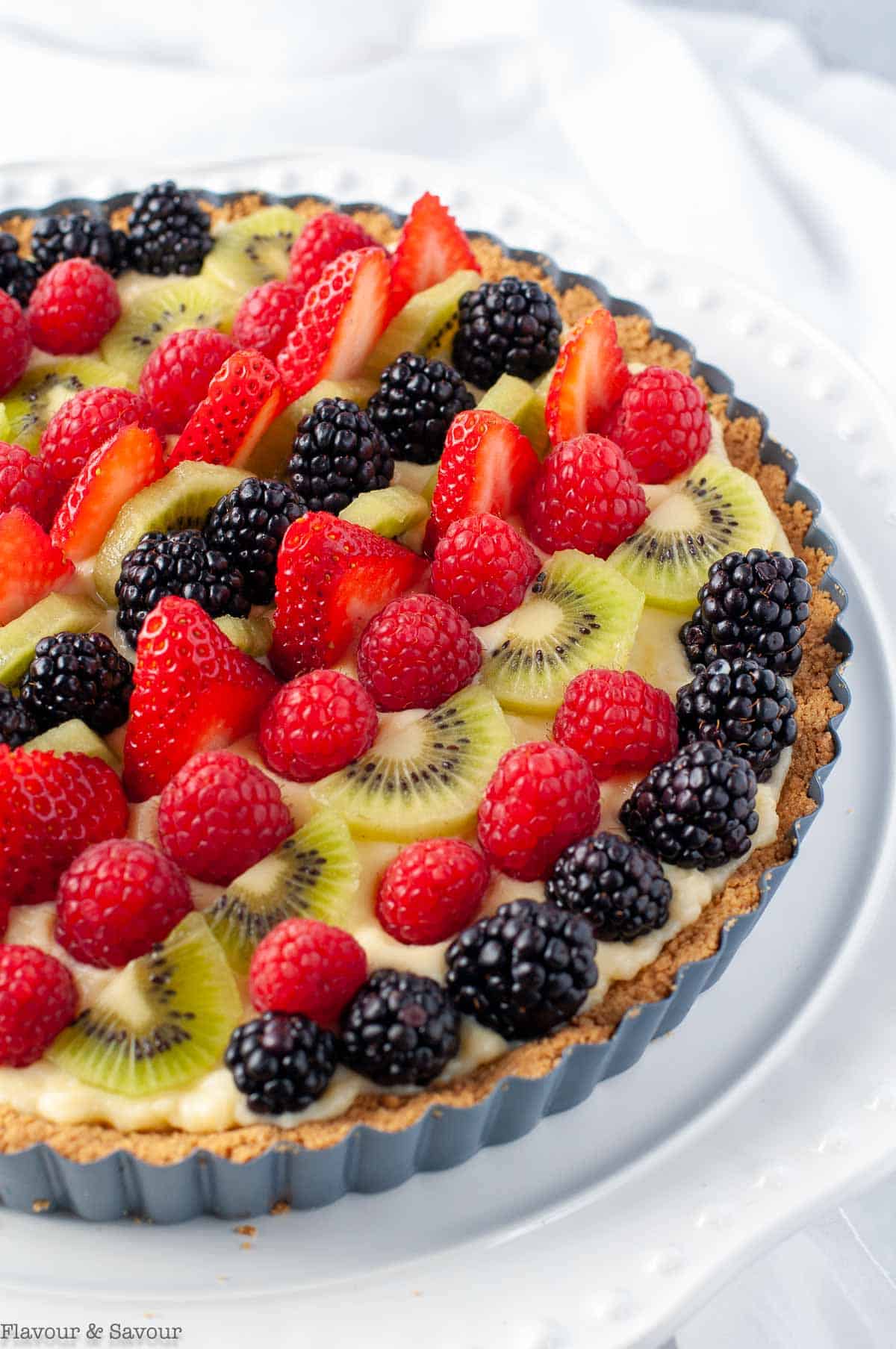 Fruit tart with gluten-free graham cracker crust and fresh fruit.