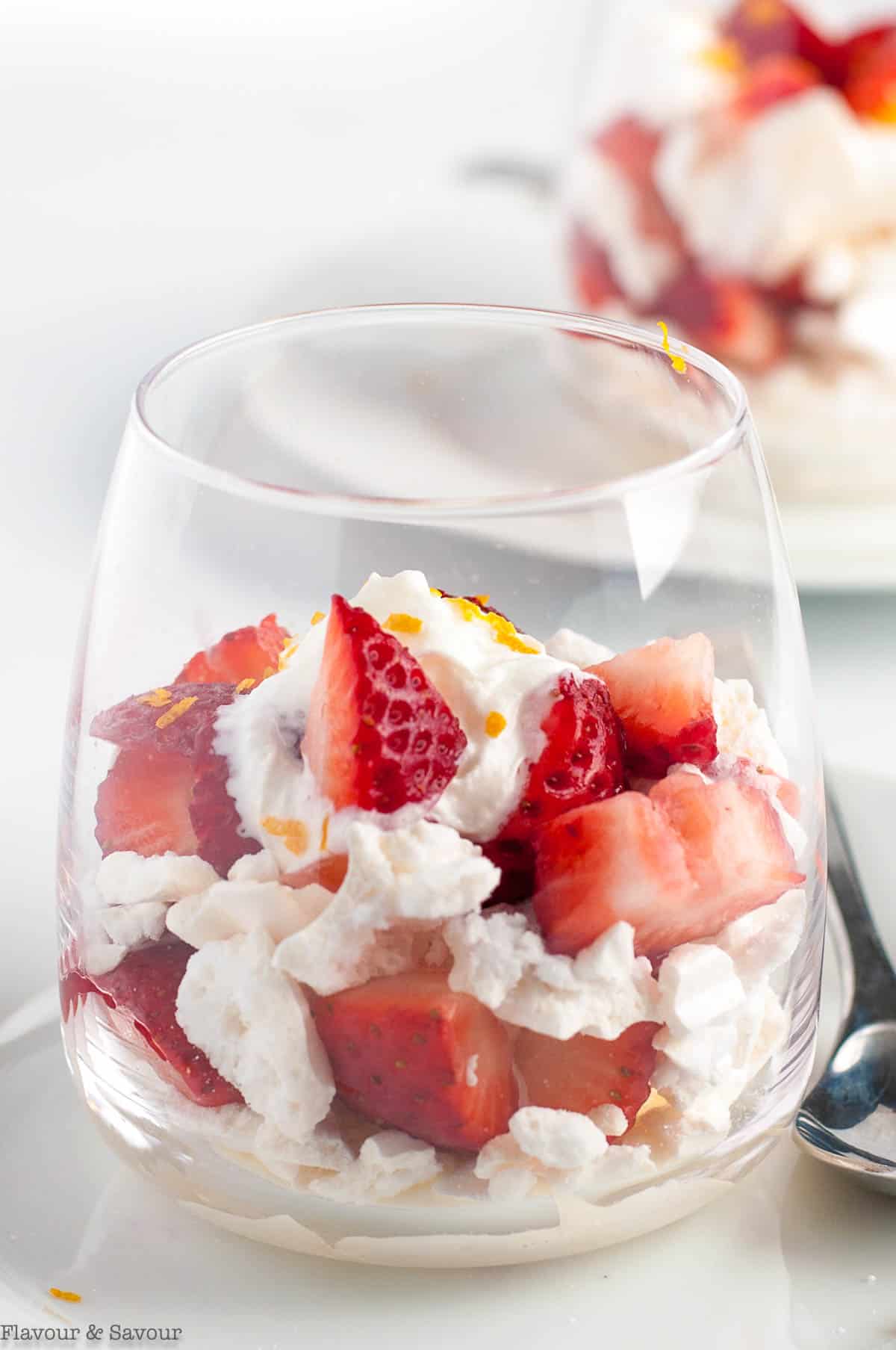 Close-up view of a dessert glass with strawberry Eton Mess.