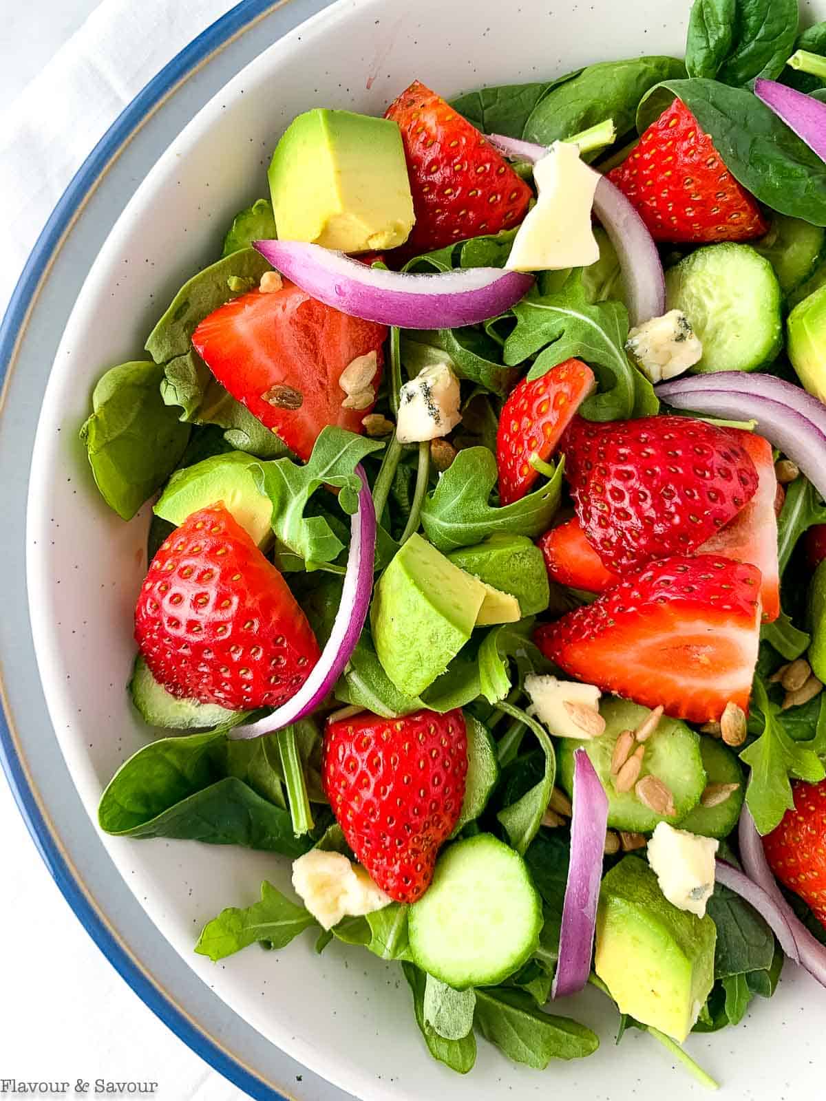 Close up overhead view of strawberry spinach salad.