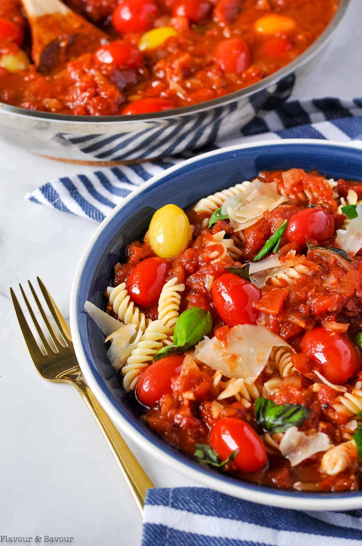 a bowl of pasta with arrabbiata sauce.