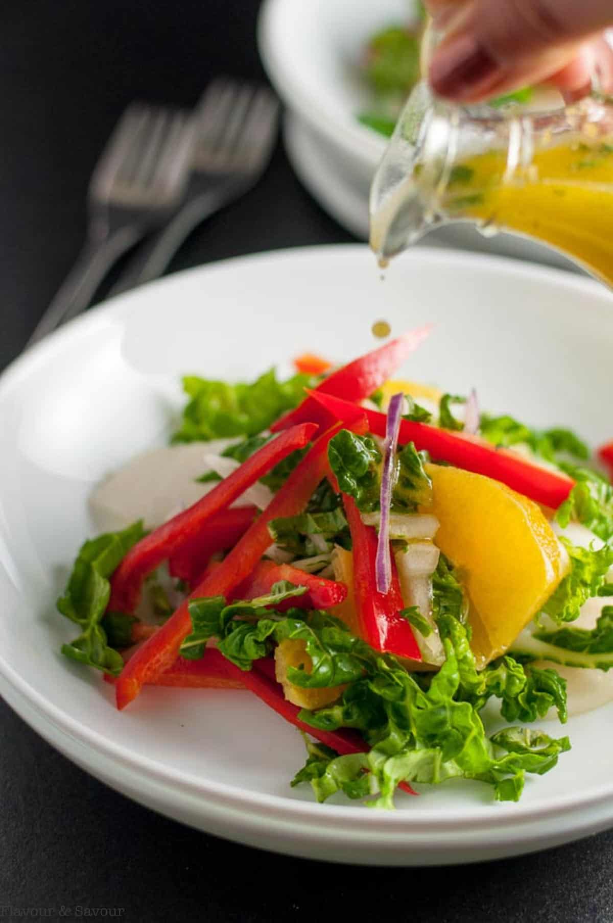 Drizzling Ginger Orange Dressing on Baby Bok Choy Salad