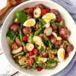 overhead view of a bowl of green bean potato salad with anchovy dressing.