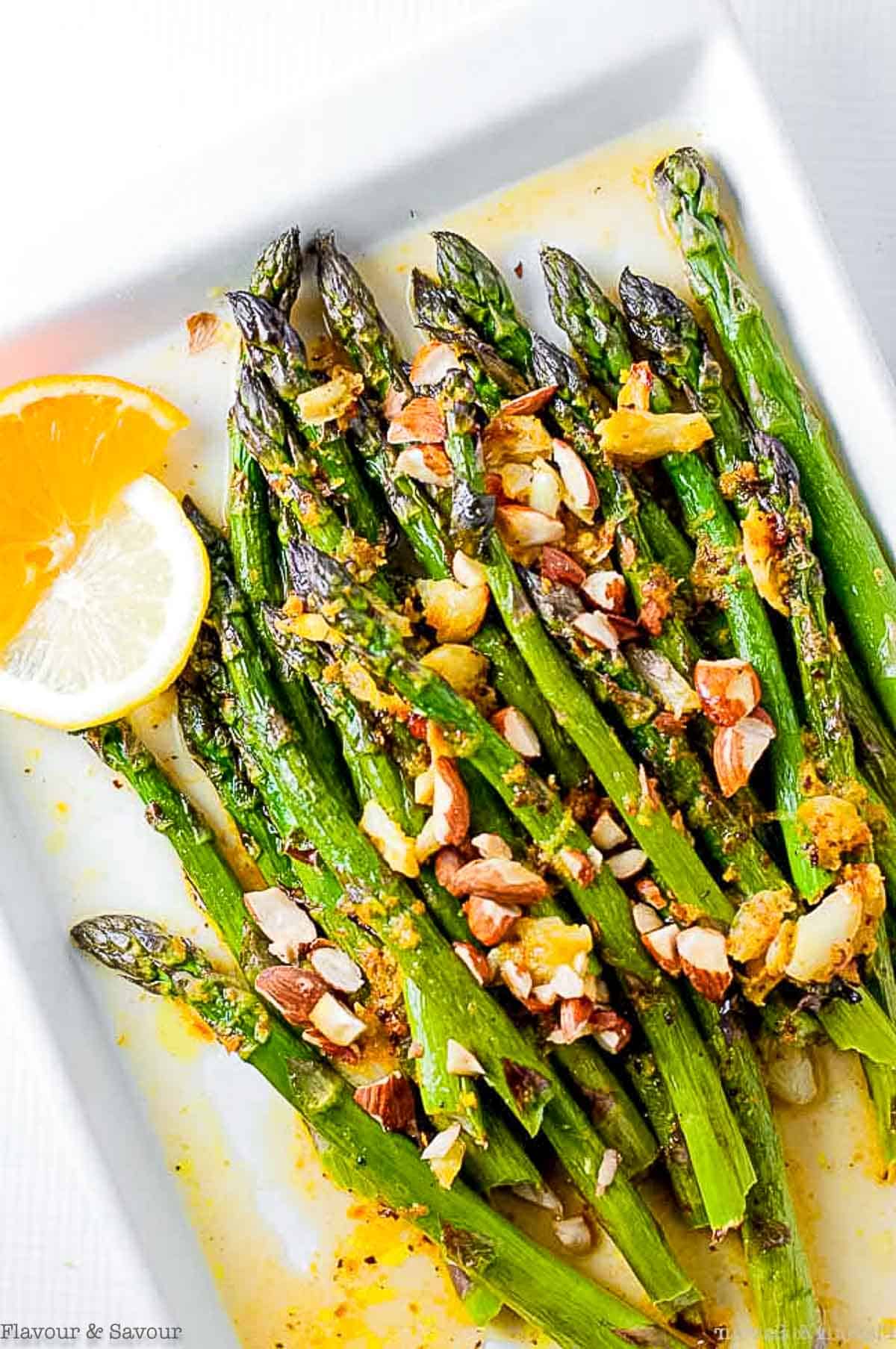 Charred asparagus with warm citrus sauce.