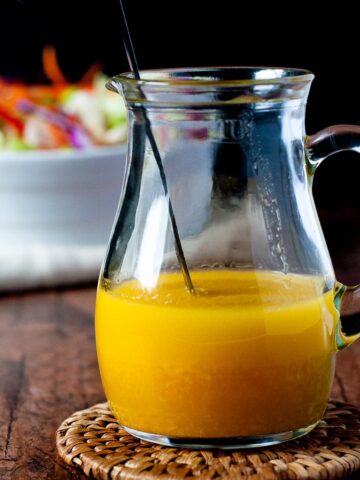 a pitcher of ginger orange dressing.