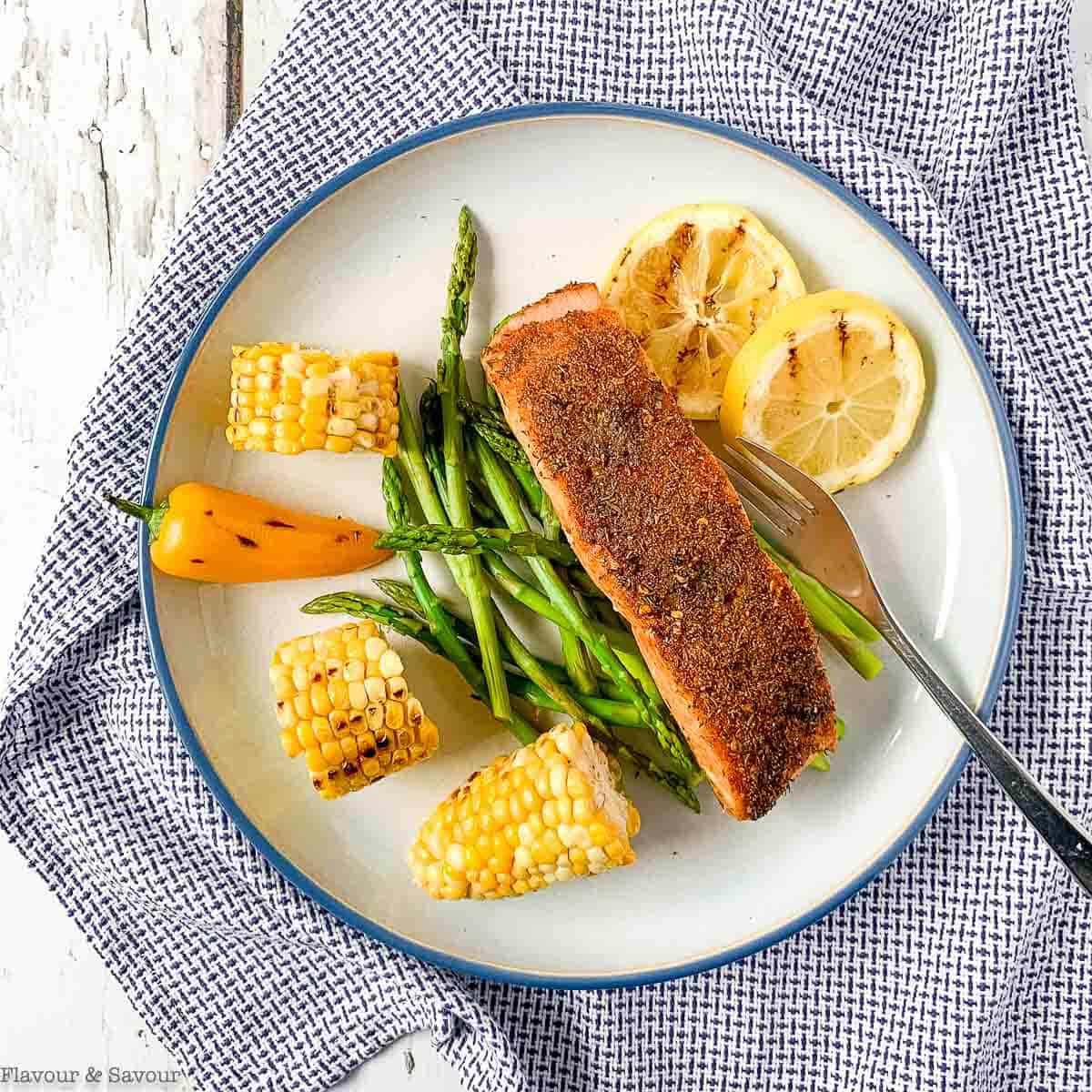 Cajun Spiced Salmon with corn on the cob and asparagus.