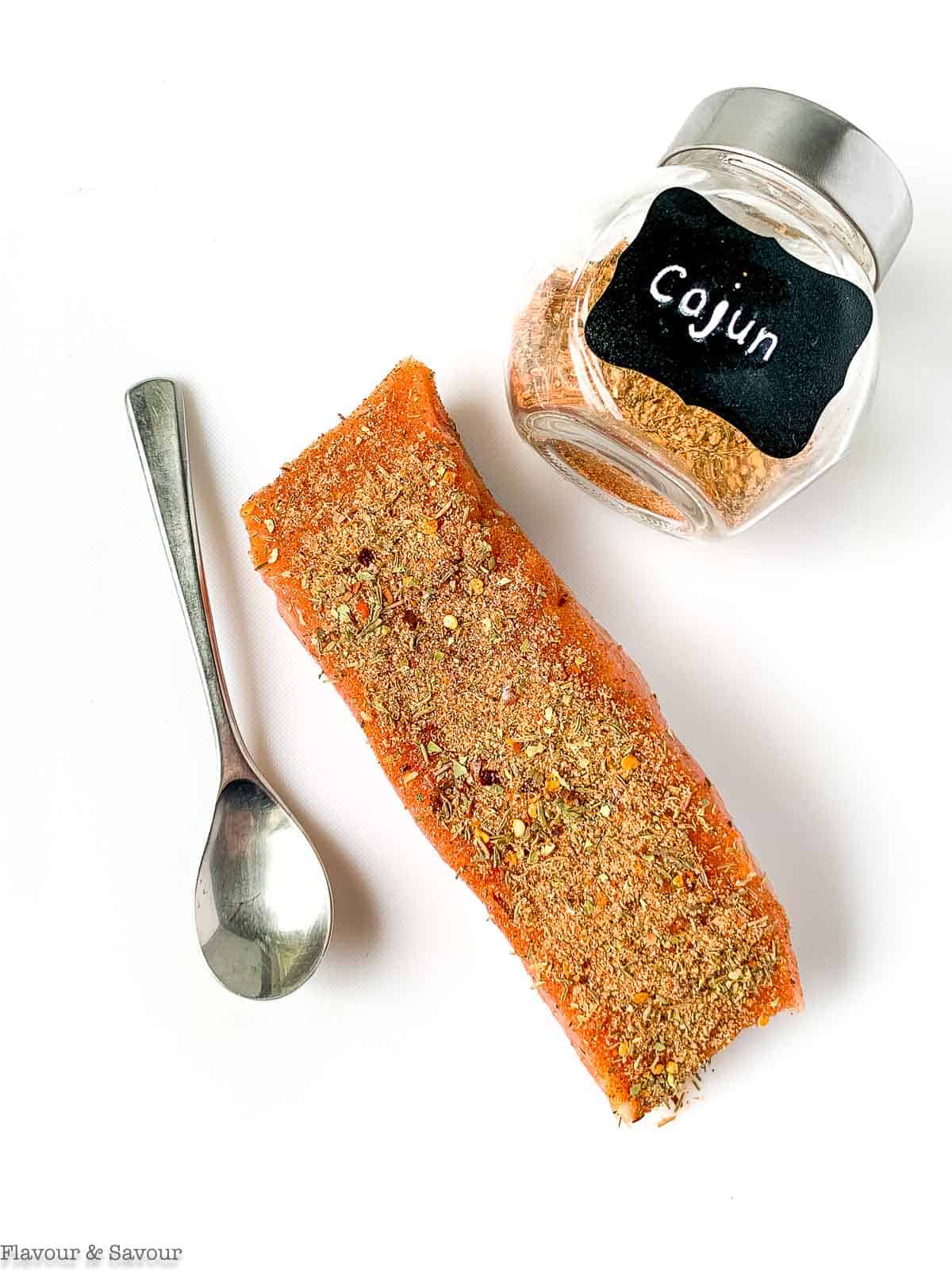 A salmon fillet with Cajun seasoning mix.