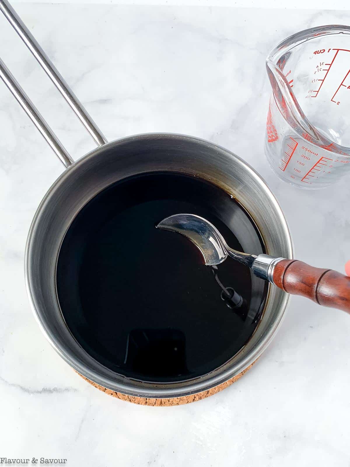 Balsamic glaze in a saucepan.