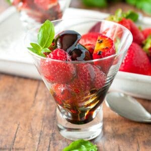 A dessert glass with balsamic strawberries.