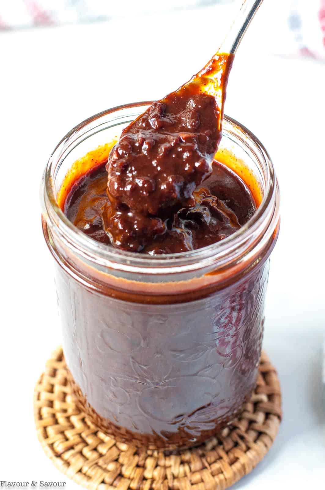 Chunky Cherry Barbecue Sauce on a spoon.