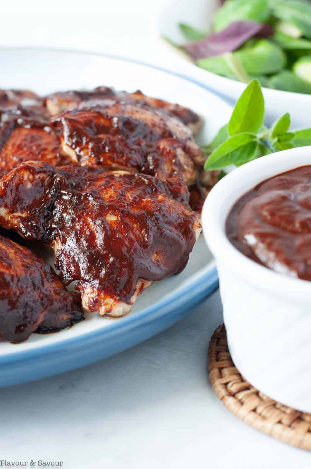 Homemade cherry barbecue sauce on chicken thighs.