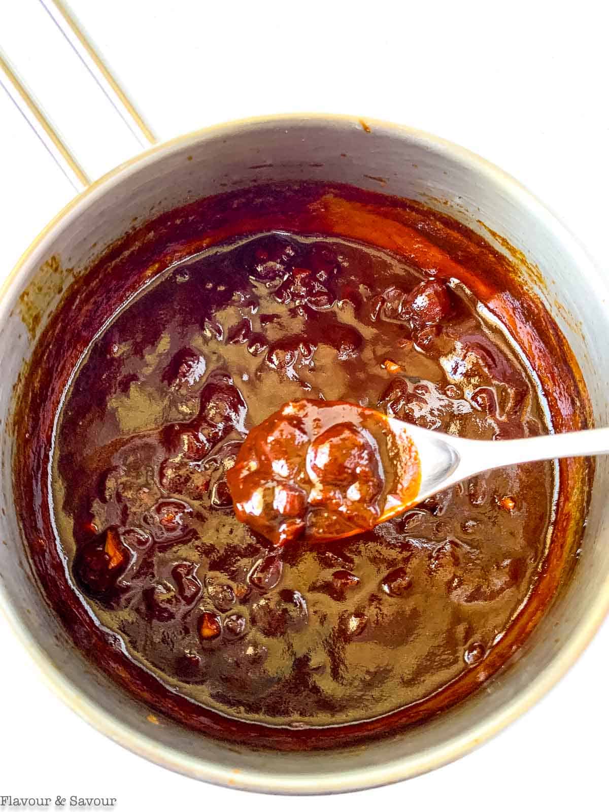 cherry barbecue sauce in a saucepan.