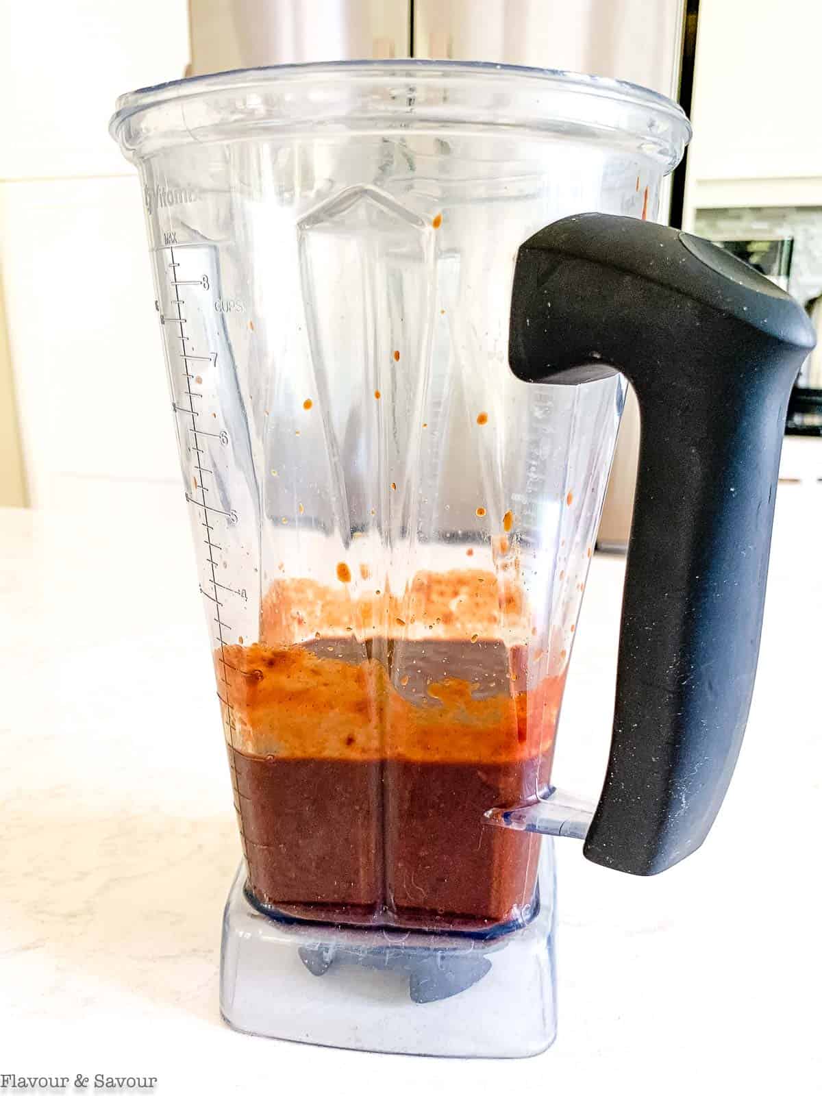 Homemade BBQ sauce in a blender container.