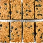 Overhead view of blueberry oatmeal breakfast bars on a cooling rack.