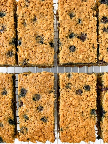 Overhead view of blueberry oatmeal breakfast bars on a cooling rack.