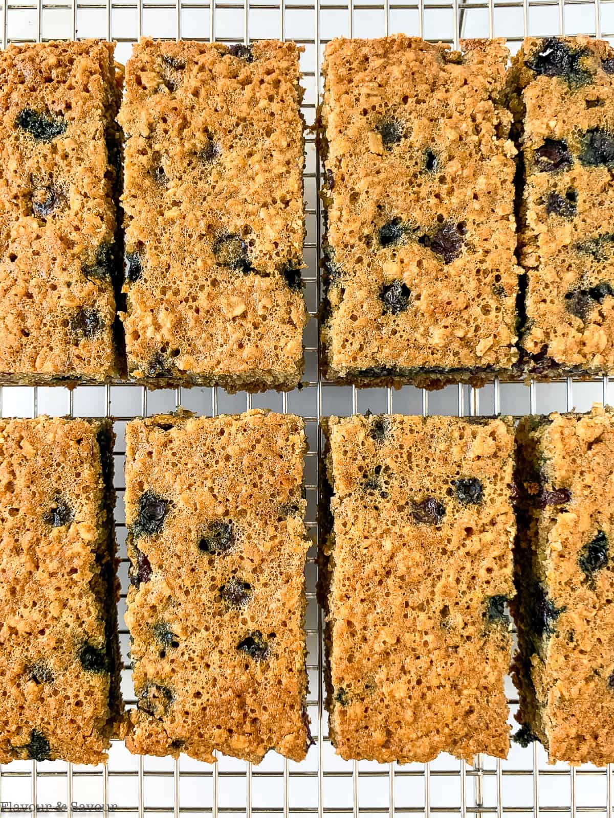 Blueberry oatmeal breakfast bars on a cooling rack.