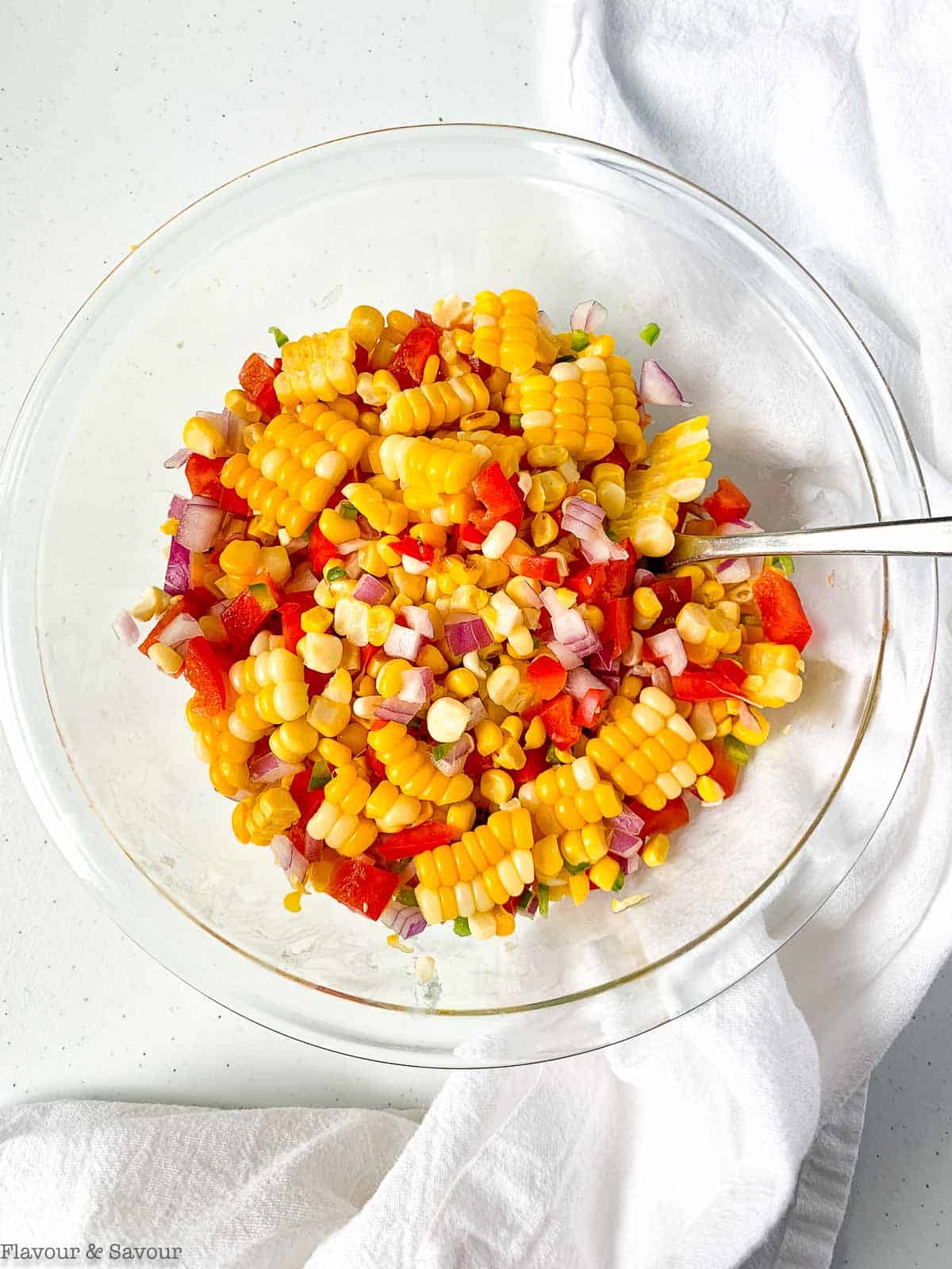 Ingredients for Mexican corn salad in a bowl.