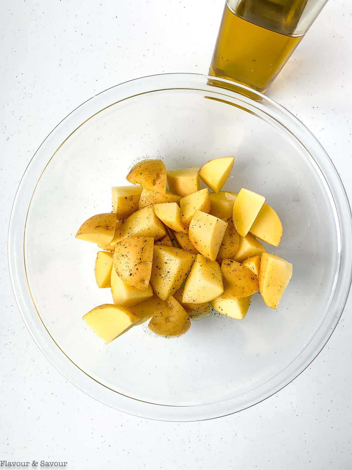 Potatoes tossed with olive oil, salt and pepper.