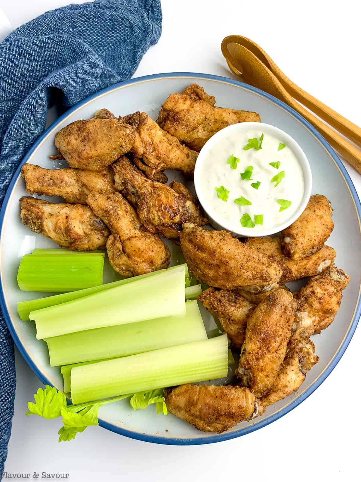 A plate of Air Fryer Old Bay Chicken Wings with Blue Cheese Dip