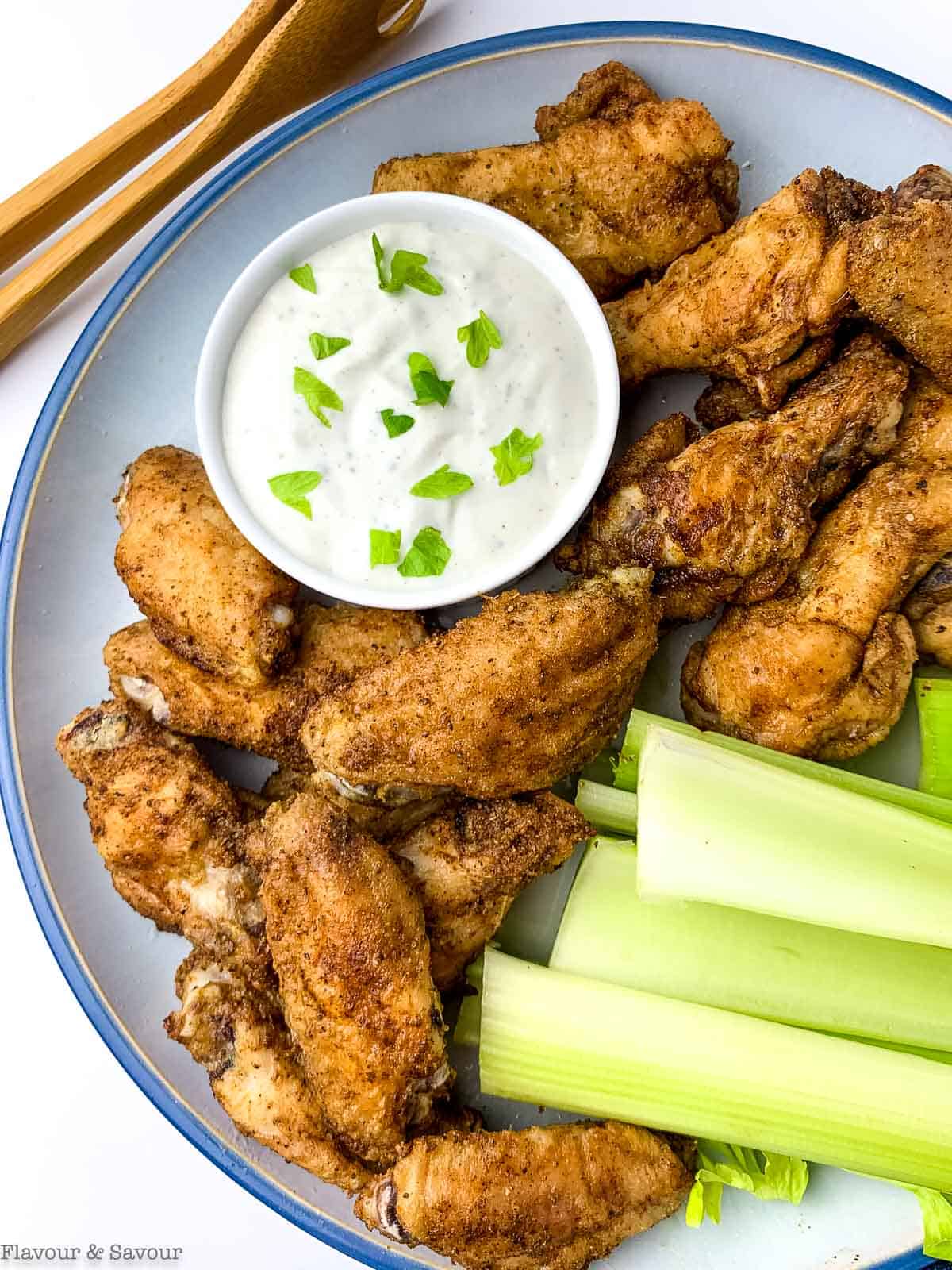 Overhead view of Old Bay chicken wings with Blue Cheese Dip.