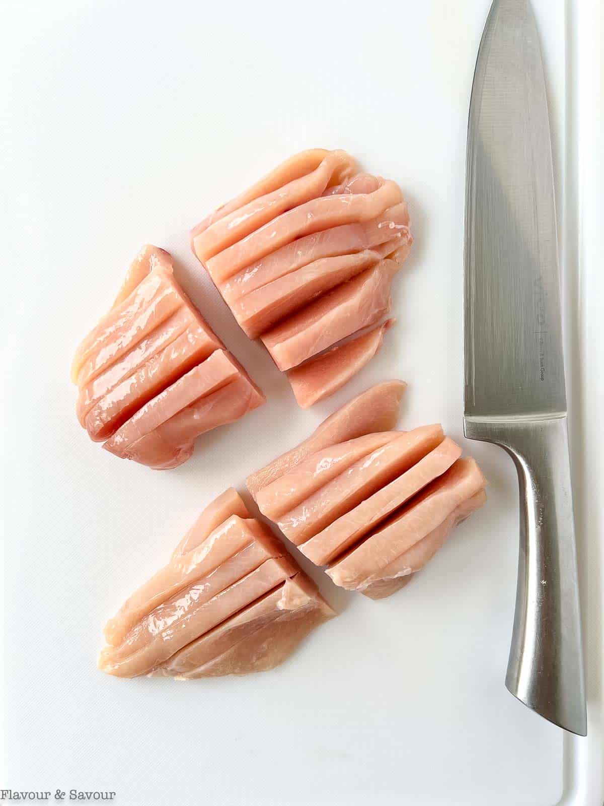 Sliced chicken breasts for Thai curried chicken