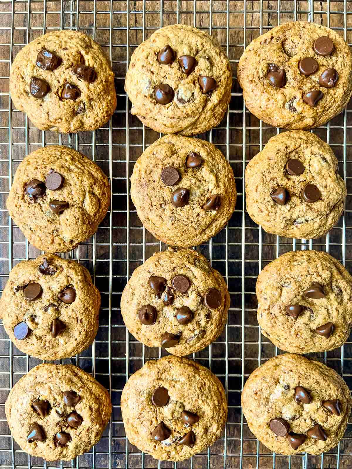 Gluten-free chocolate chip cookies on a cooling rack.
