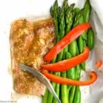 Miso salmon filet with asparagus and red pepper strips.