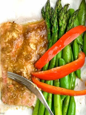 Miso salmon filet with asparagus and red pepper strips.