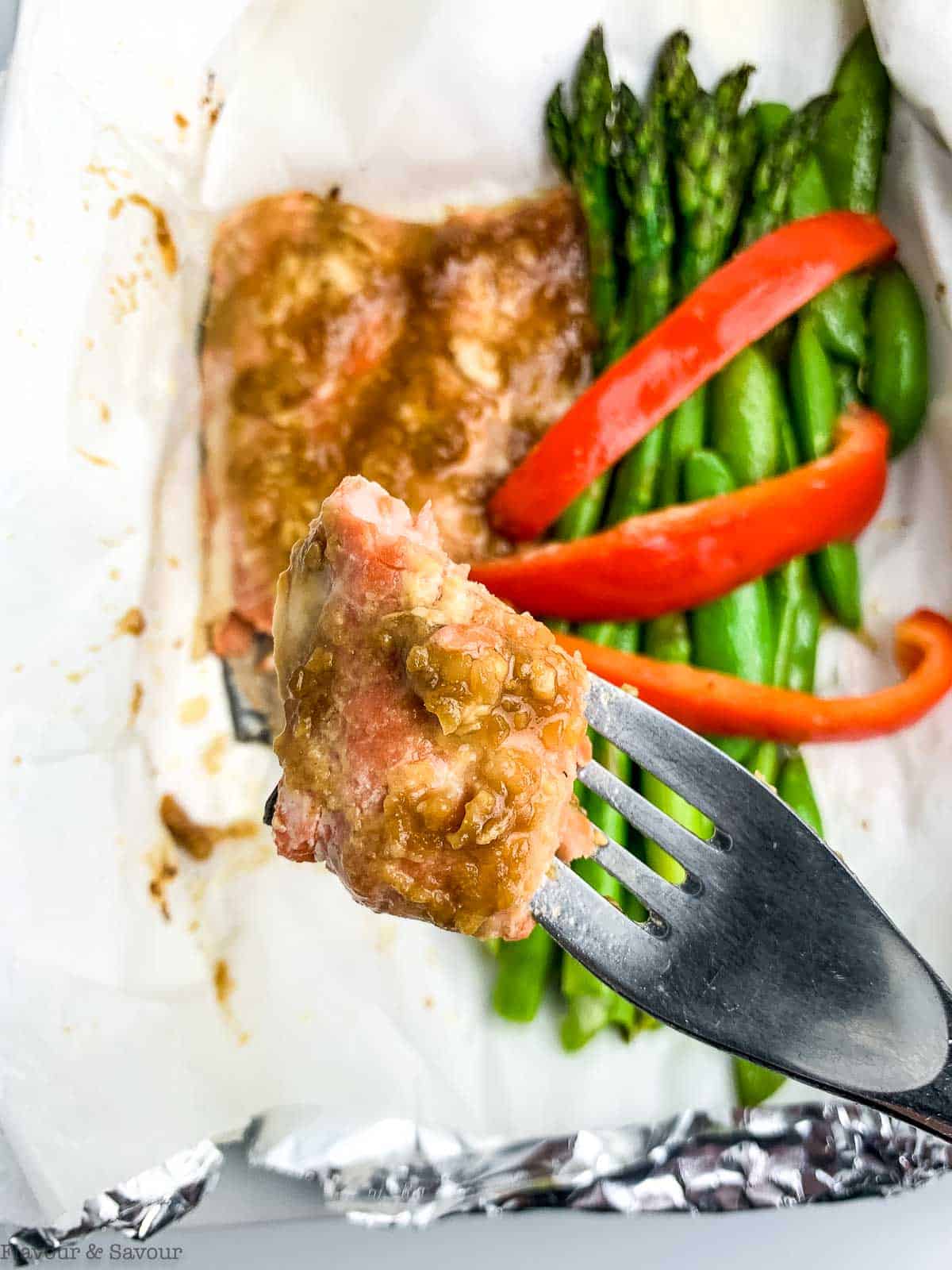 Miso Salmon filet with asparagus, sugar snap peas and red pepper strips.