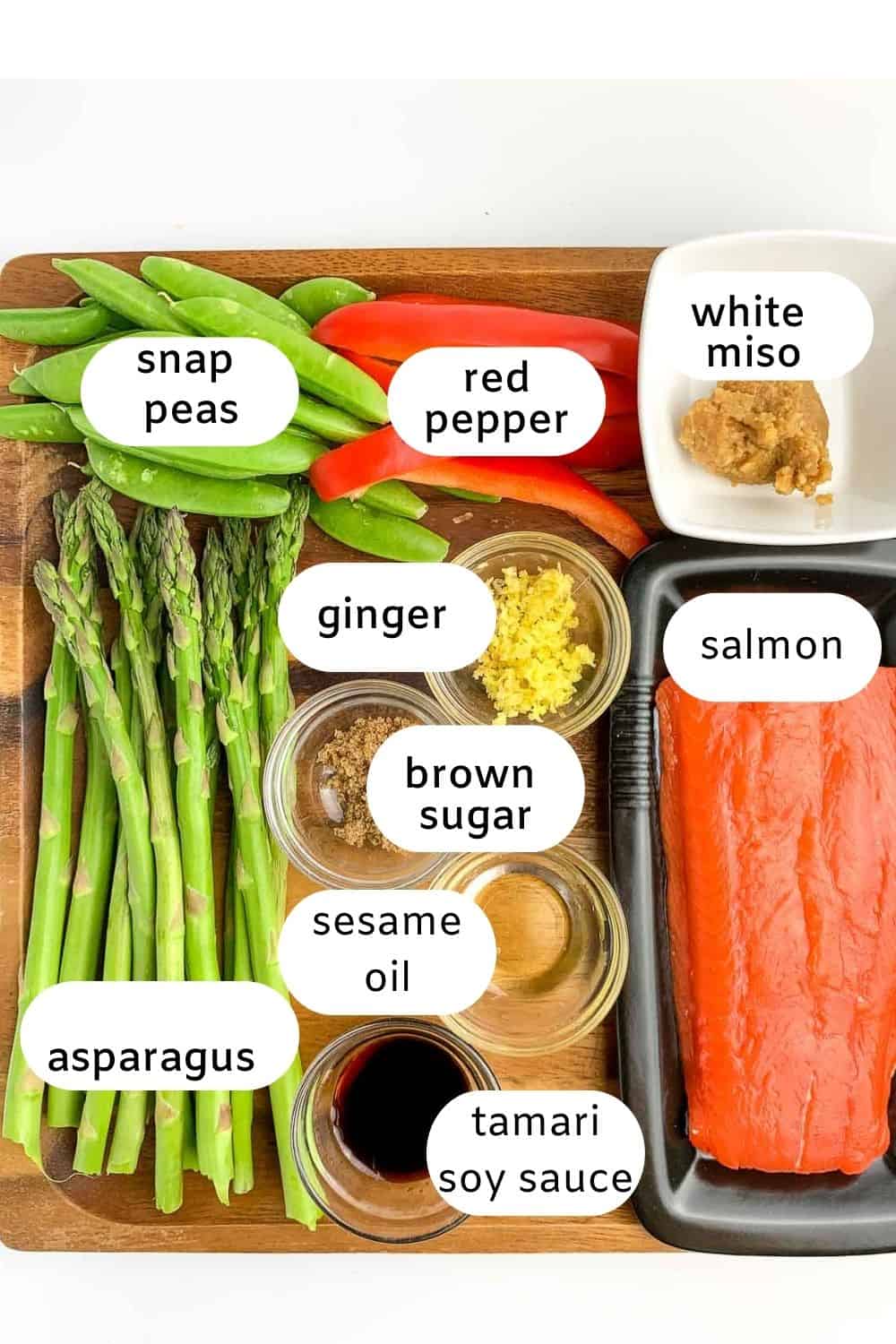 Ingredients with labels for miso salmon in foil packets.