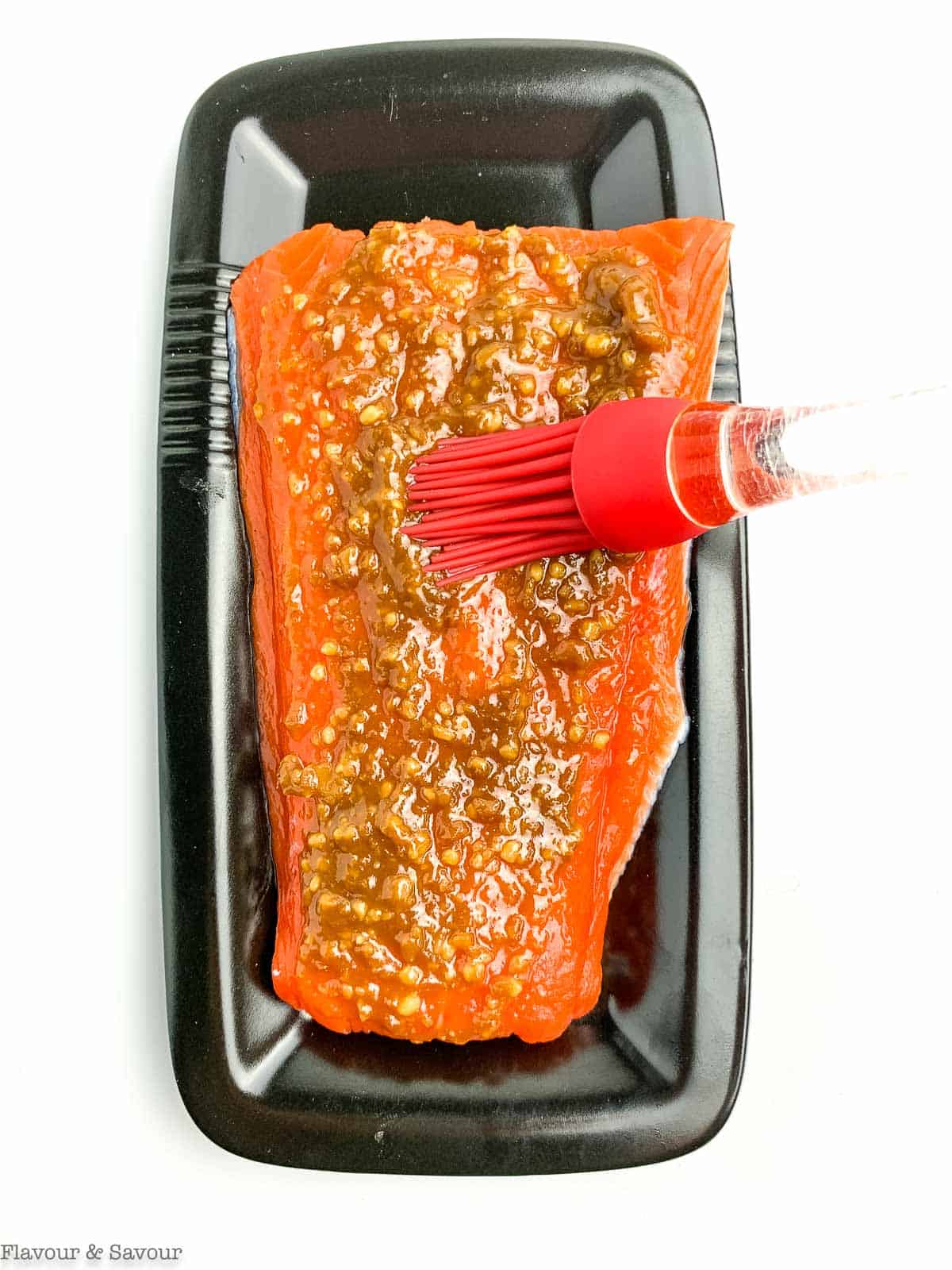 Miso glazed brushed on a sockeye salmon fillet.